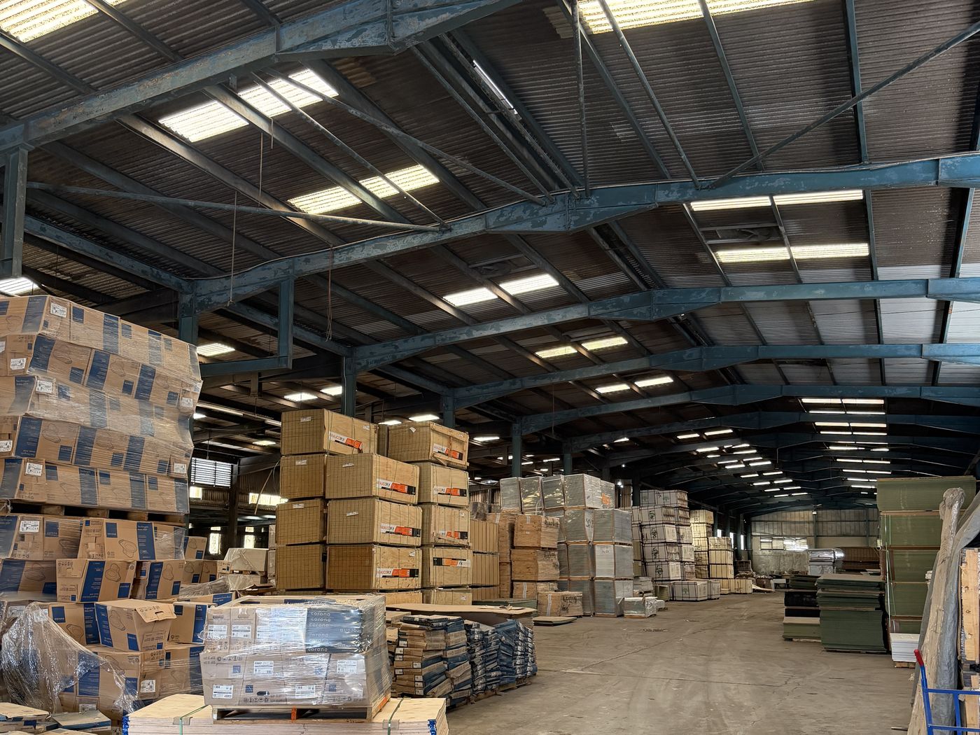 Inside the main warehouse, pallets stacked down the length of the building